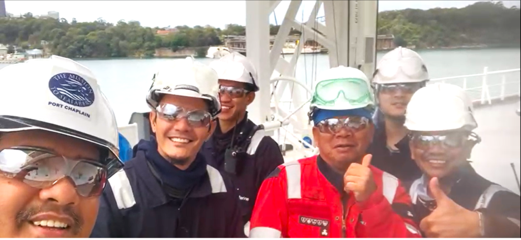 Seafarers giving a thumbs up to Mission to Seafarers Sydney